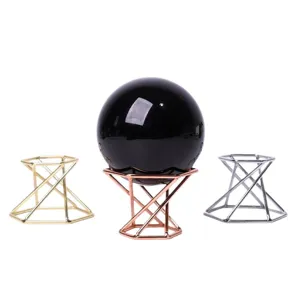 Crystal ball metal display stand geometric iron base holder for home decor and crafts.