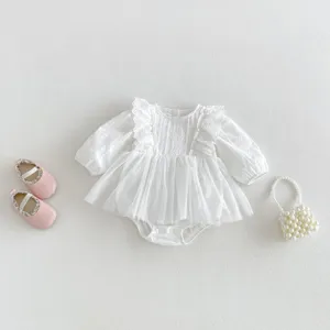 Detailed view of white baby girl long sleeve lace romper dress with cute mesh skirt overlay.