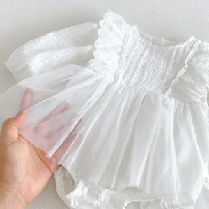 Infant baby girl white lace mesh long sleeve romper detail close-up, soft and breathable fabric.