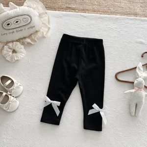 Infant baby girl black leggings with cute white bow details, high elastic slim pants.