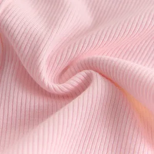 Pink ribbed knit fabric close-up detail texture for baby leggings, soft and elastic.