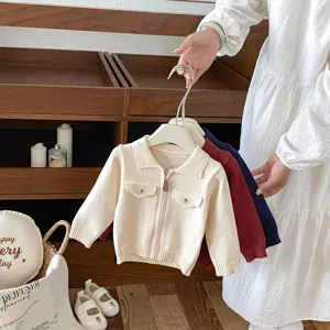 Infant knit cardigan detail, front zipper design, dual cargo pockets, soft texture fabric.