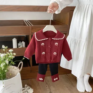 Toddler knit cardigan and leggings set with bow details, cozy autumn baby outfit.