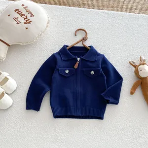 Dark blue baby knitted cardigan detail, lapel collar, front zipper closure and dual chest pockets.