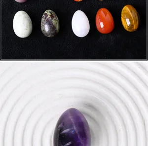 Natural crystal stone egg ornament detail shot, polished gemstone mini bird egg for home decor.