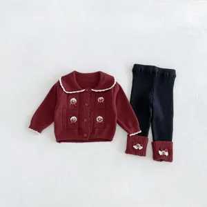 Toddler knit cardigan and leggings detail view, featuring delicate collar trim and bows.