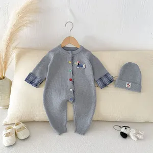 Adorable infant baby gray knitted romper set with long sleeves, plaid accents and beanie hat.