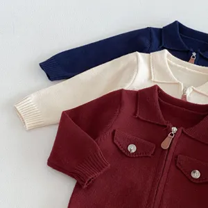 Infant baby knit cardigan detail showing lapel collar, zipper and pocket design features.