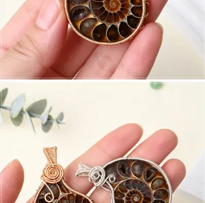 Close up view of handmade wire wrapped ammonite fossil pendant showing natural spiral shell details.