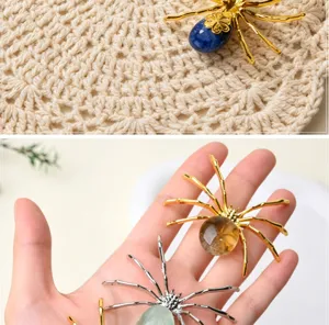 Detailed view of natural crystal tumbled spider ornament for unique desk decor and Halloween.
