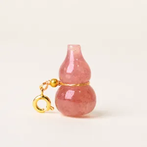 Natural strawberry quartz gourd pendant with gold clasp, elegant crystal necklace charm for women.