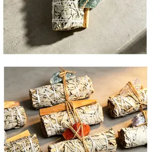White sage smudge stick set close-up, natural crystal and palo santo wood bundle for healing
