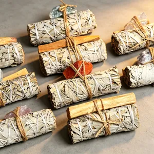 White sage bundles and raw crystal stones set for space cleansing, meditation, and yoga healing.