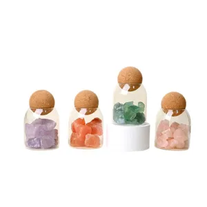 Natural crystal raw stones in clear glass jars with cork lids, healing gemstone home decor.