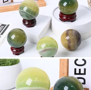 Natural green fluorite crystal sphere desktop ornament detail view with wooden base decor