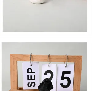 Close-up detail of natural crystal raw stone desktop ornament with cute wooden calendar prop.
