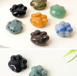 Detailed view of assorted mini crystal cat paw carvings, perfect for DIY jewelry and crafts.