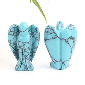 Turquoise-colored stone angel carving detail showing front and back views, crystal craft ornament.