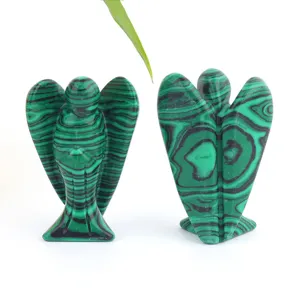 Detail view of natural malachite crystal carved angel ornament, fine texture and polishing.