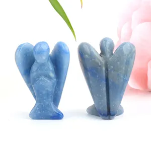 Natural blue crystal quartz angel figurine detail, healing stone gemstone carving ornament.