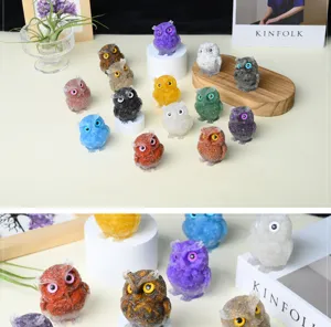 Detailed shot of colorful crystal crushed stone resin owl figurines on desktop display