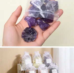 Natural crystal raw stone gift bag set with purple and white stones for aromatherapy decor.