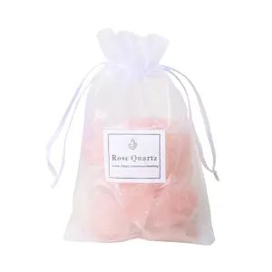 Natural rose quartz rough stone in white organza gift bag crystal healing decor main image