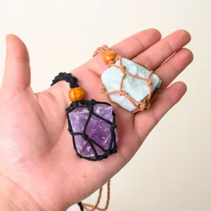 Handcrafted natural stone crystal pendant necklace with adjustable woven net rope.
