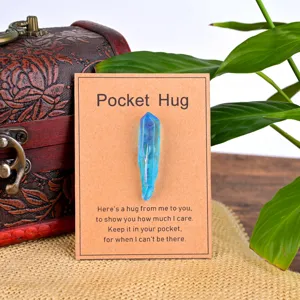 Blue aura quartz crystal pocket hug stone with greeting card for gift giving and daily decor.