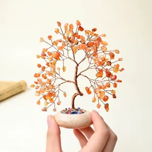 Natural crystal money tree ornament with orange gemstone chips and stone base for home decor.