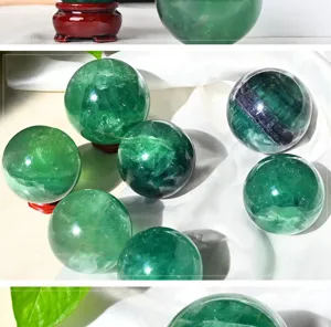 Natural green fluorite crystal sphere detail shot, polished raw stone energy ball for home decor.