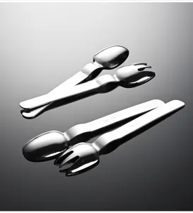 Stainless steel children spoon fork detail view, creative tableware shiny surface display.