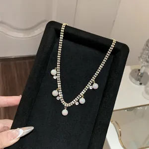 Closeup view of the Korean style double-strand rhinestone necklace with pearl pendants.