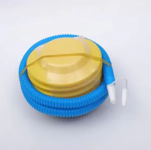 Portable foot air pump detail view, plastic inflation tool with flexible blue hose and nozzle.