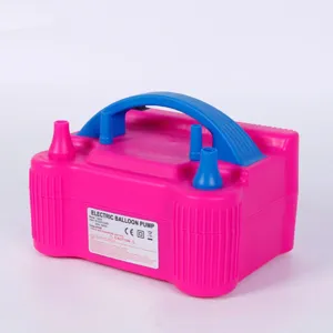 Detail view of the pink electric balloon pump with dual nozzles and blue handle, powerful 600W.