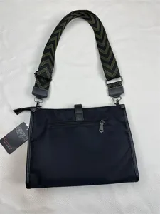 Black nylon crossbody bag with geometric wide strap, stylish casual shoulder bag for men.