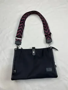 Fashion nylon crossbody bag with black oxford cloth and pink zigzag wide shoulder strap.