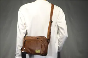 Brown PU leather men's casual crossbody bag with adjustable strap and front zipper pocket.