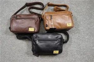 Casual men's soft leather messenger bag detail showcasing multi-color options and zippers.