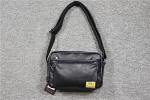 Three-box stylish men black soft leather messenger bag with adjustable shoulder strap and pockets.