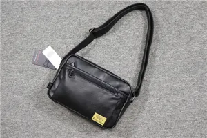 Black leather crossbody bag for men with adjustable shoulder strap and multiple zip pockets.
