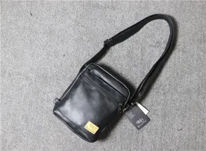 Men's vertical PU leather shoulder bag, vintage black messenger bag for daily casual use.