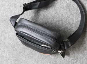 Black soft leather men vertical shoulder bag detail view, retro crossbody messenger bag.