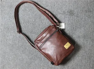 Men's brown vertical PU leather shoulder bag casual retro crossbody messenger bag detailed shot.