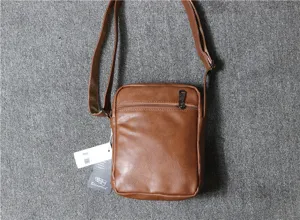 Men's vertical brown soft leather shoulder bag casual daily messenger bag with zipper pocket.