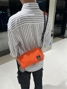 Orange canvas crossbody bag for men and women, casual daily shoulder sling bag with adjustable strap.