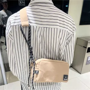Fashion canvas crossbody bag for men and women, casual daily sling bag with rope strap.