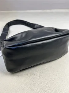 Black leather casual shoulder crossbody bag for men and women, stylish daily commuter daily use.