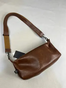 Retro brown leather messenger bag detail, casual shoulder bag with adjustable strap.