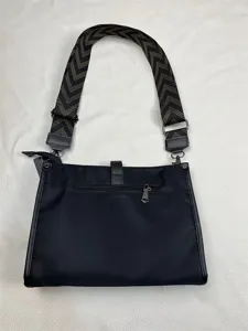 Black nylon crossbody bag detail, casual shoulder bag with wide strap, daily casual men bag.